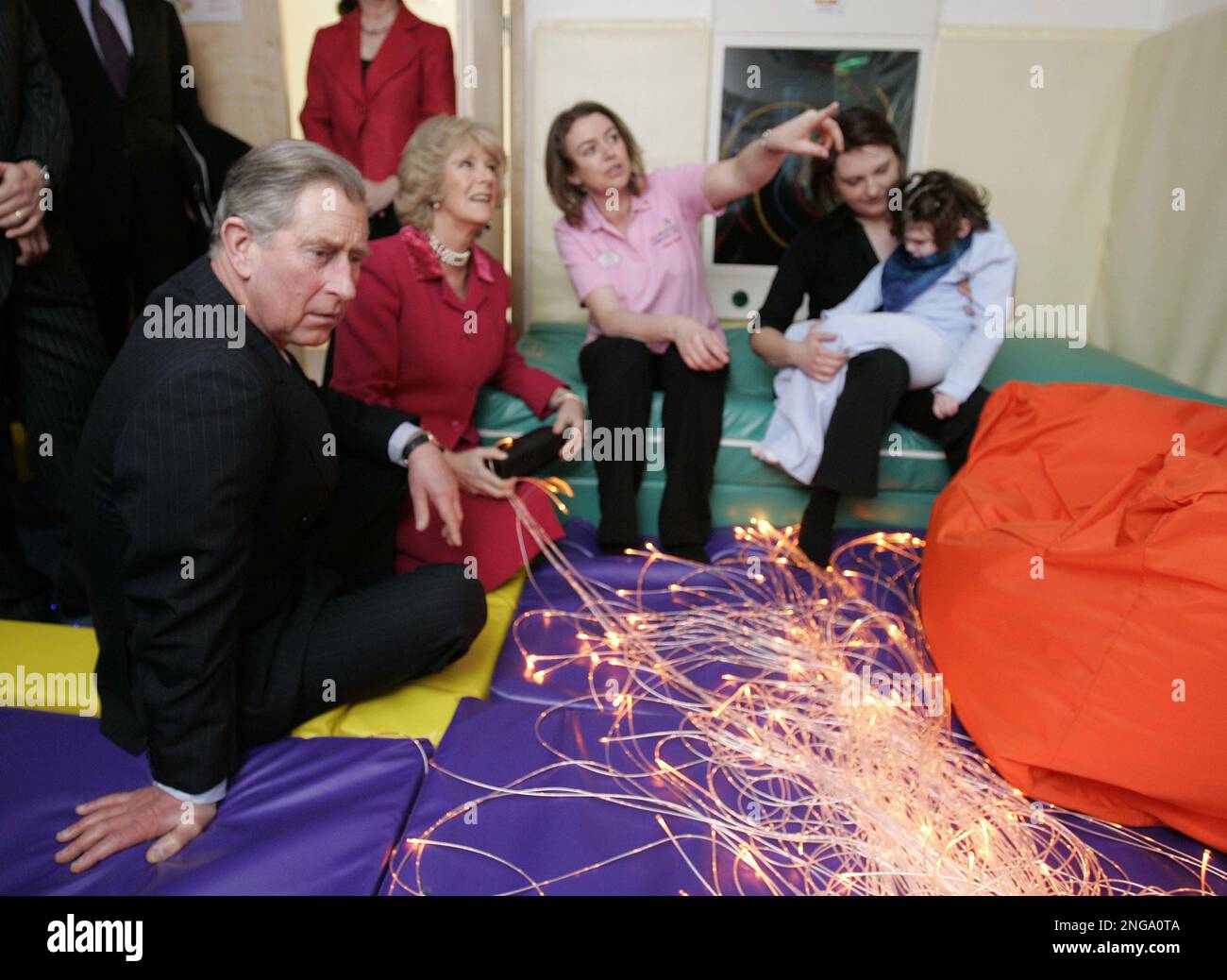 The Prince of Wales and Duchess of Cornwall talk with staff during a visit to open the Shooting Star House Children's Hospice in Hampton, south-west London, Tuesday 21st February, 2006. (AP Photo/Michael Dunlea/Dail Mail, Pool) Stockfoto