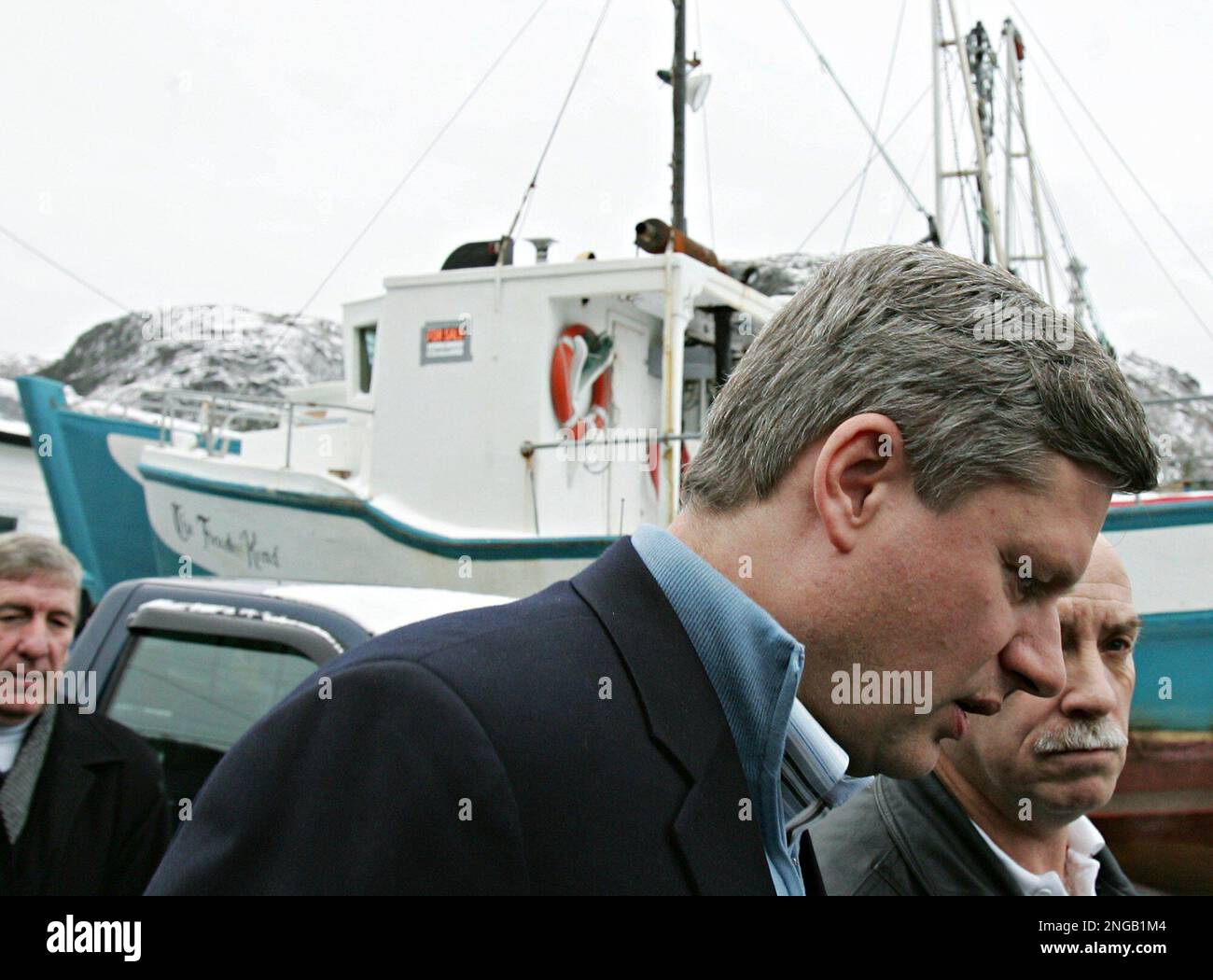 Conservative Leader Stephen Harper, second from right, speaks with Nat