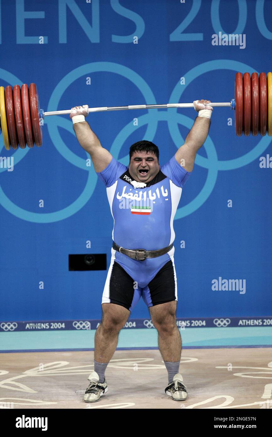 gold-medalist-hossein-reza-zadeh-of-iran-lifts-581-pounds-263-5-kg