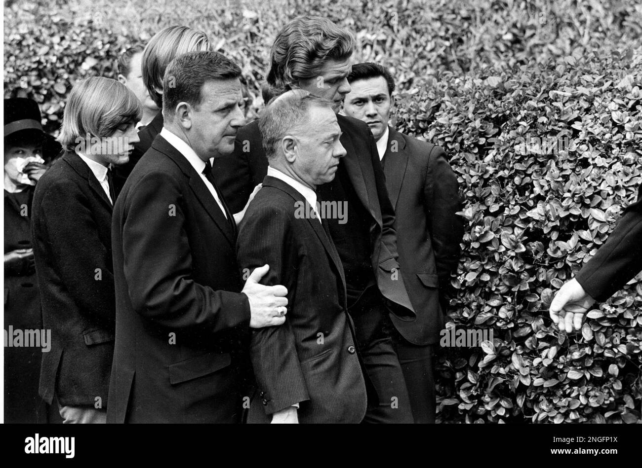 Actor Mickey Rooney watches the casket of his estranged wife, Barbara