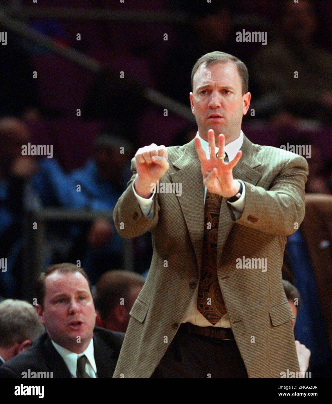 Minnesota head coach Dan Monson signals to his team during the first