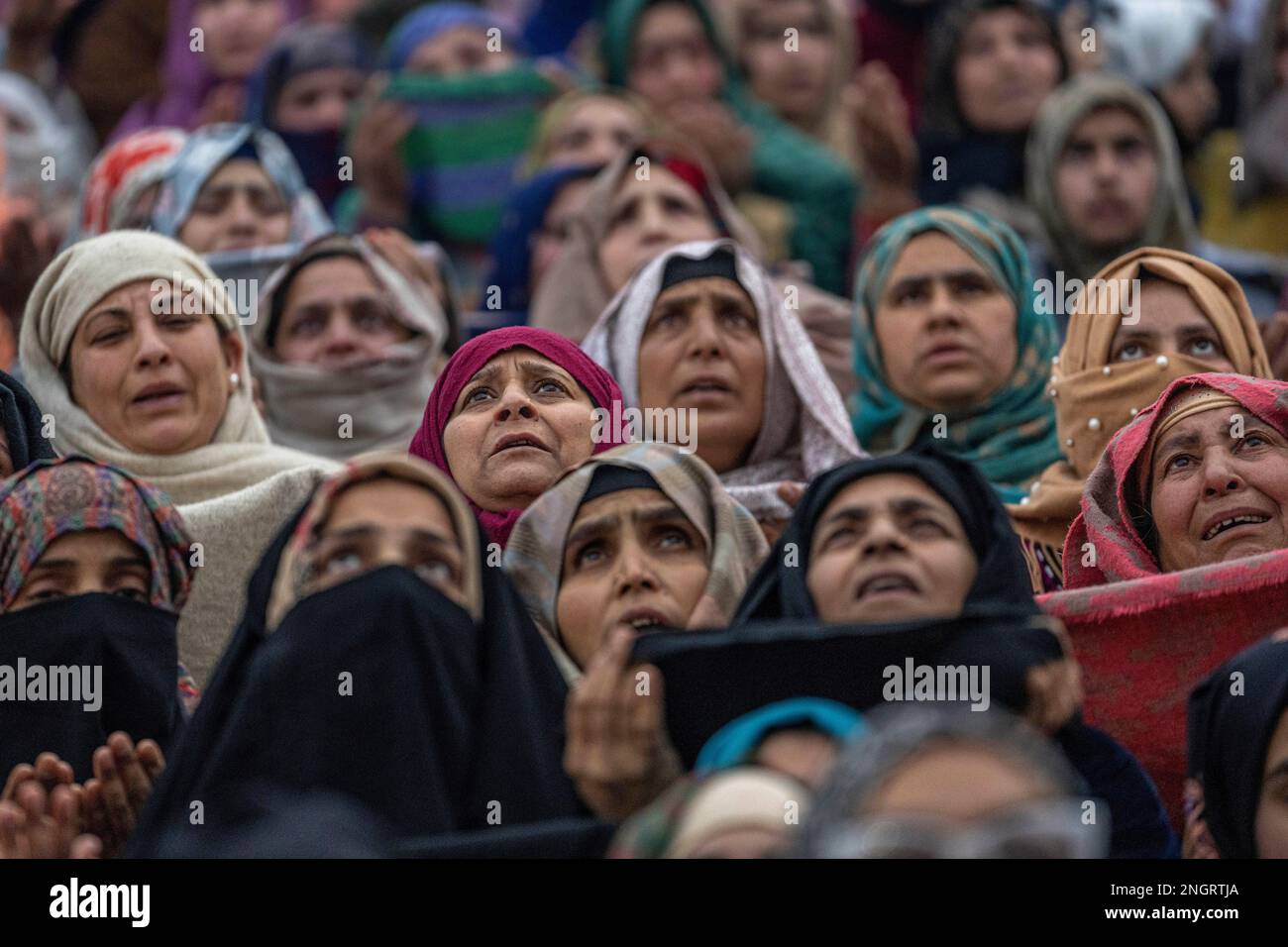 Kashmiri Muslim women pray as the head priest displays a relic at the ...