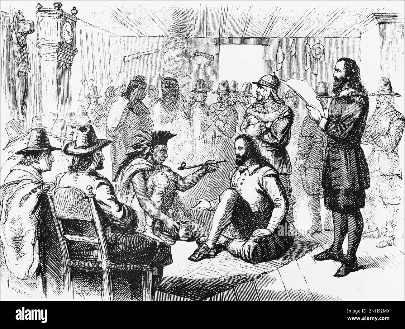 Der Wampanoag-Führer Massasoit (ca.1581-1661) raucht mit dem Plymouth-Gouverneur John Carver eine Friedenspfeife, nachdem er 1621 einen Vertrag unterzeichnet hatte. Gravur von vor 1898. Stockfoto