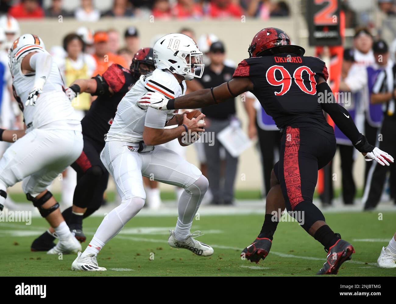 SAN DIEGO, CA - SEPTEMBER 10: Idaho State Bengals quarterback Tyler Vander Waal (18) is sacked by San Diego State Aztecs defensive lineman Daniel Okpoko (90) during a college football game between the Idaho State Bengals and the San Diego State Aztecs on September 10, 2022, at Snapdragon Stadium in San Diego, CA. Vander Waal was injured on this play and exited the game. (Photo by Chris Williams/Icon Sportswire) (Icon Sportswire via AP Images) Stockfoto
