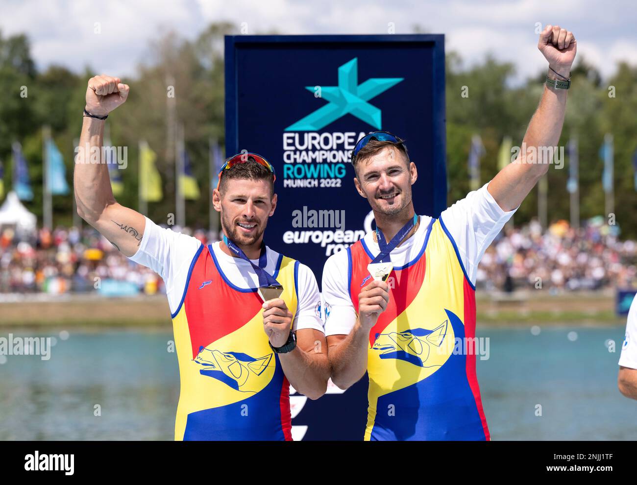 Romania's Marius Cozmiuc and Sergiu Bejan celebrate after winning the men's two-man rowing final race at the European Rowing Championships in Munich, Germany, Saturday, Aug. 13, 2022. (Sven Hoppe/dpa via AP) Stockfoto