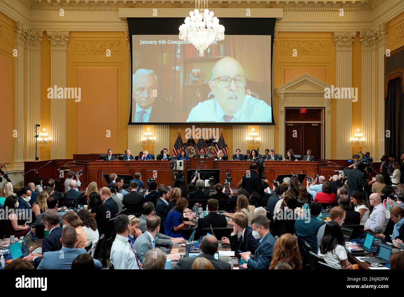 A video of Rudy Giuliani is shown on a screen during a hearing of the House select committee investigating the Jan. 6 attack on the U.S. Capitol at the Capitol in Washington, Tuesday, July 12, 2022. (Doug Mills/Pool via AP) Stockfoto