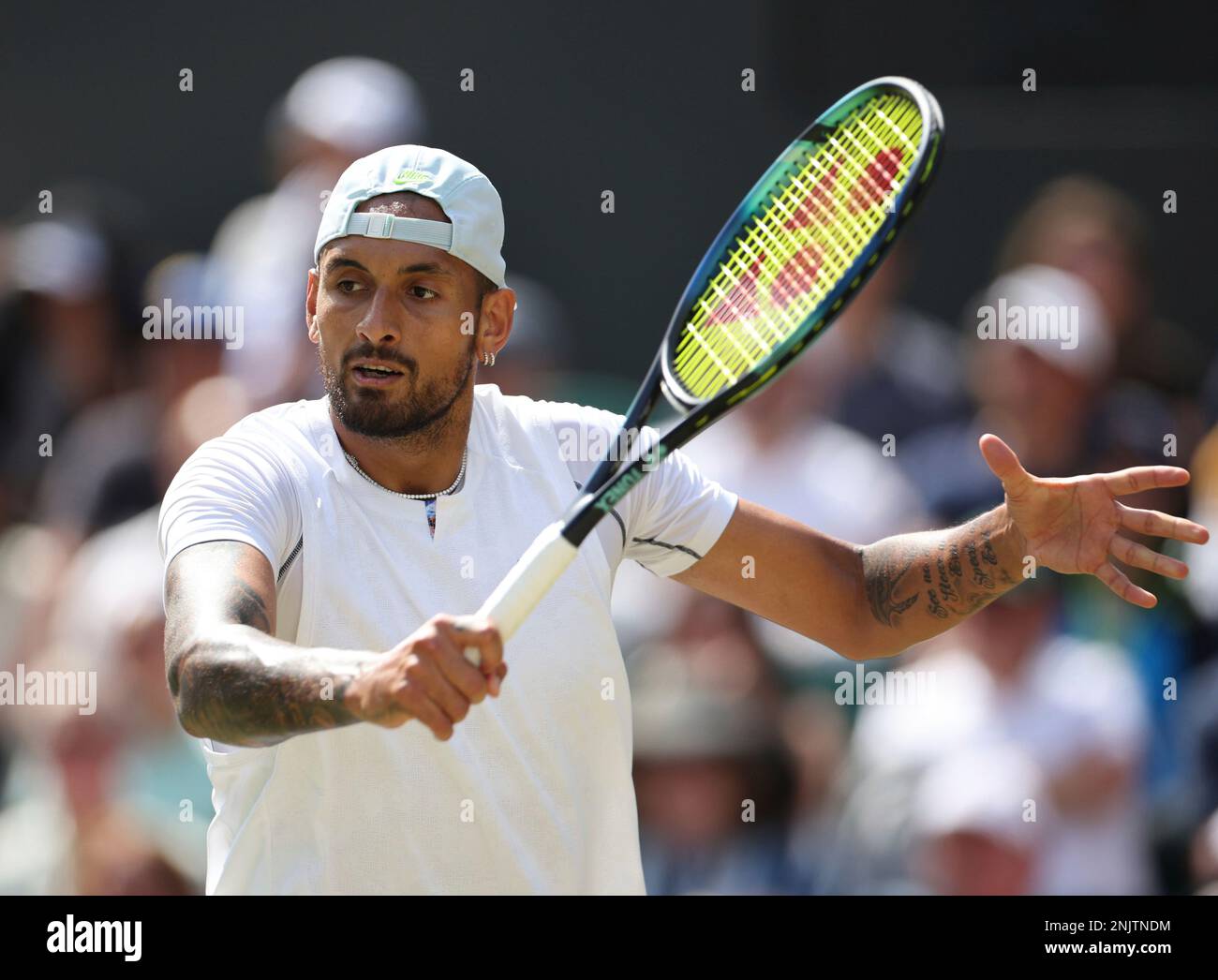 Nick Kyrgios of Australia hits a ball in the game of the gentlemen's