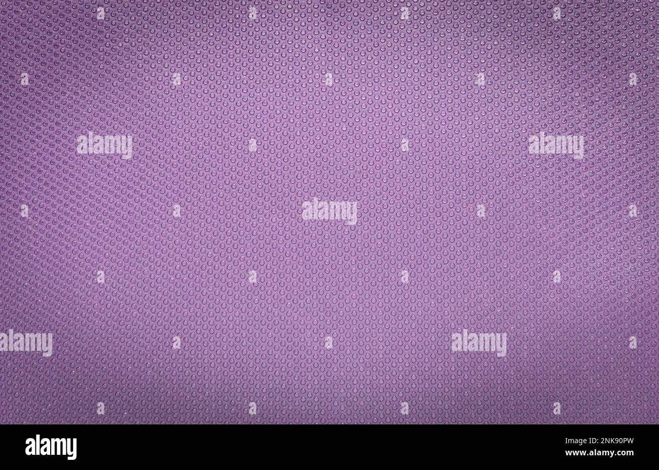 Lavendelfarbener, glitzernder Hintergrund mit runden Pickel und Vignette Stockfoto