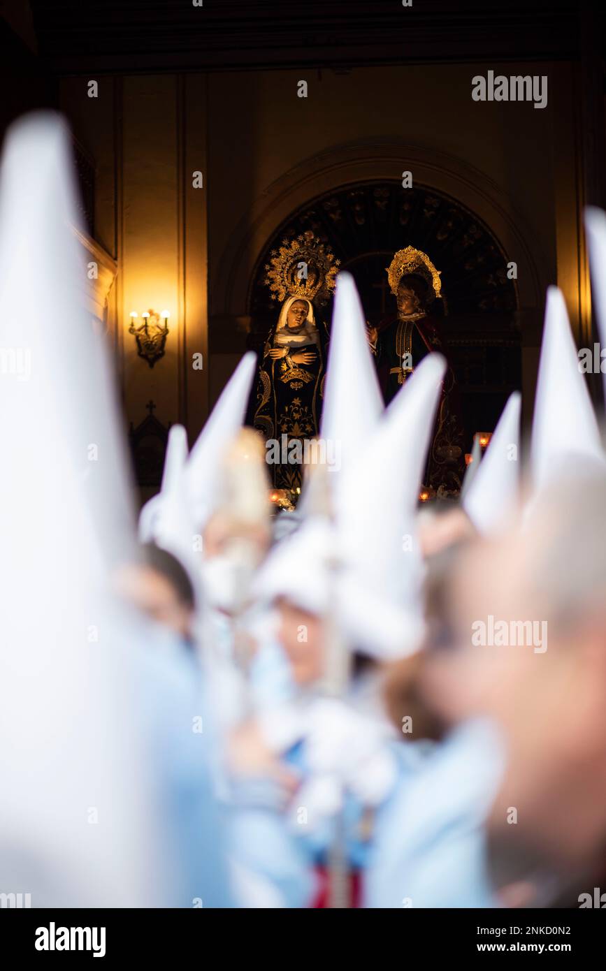 Several Nazarenes carry the paso of the Brotherhood of Our Lady of La ...