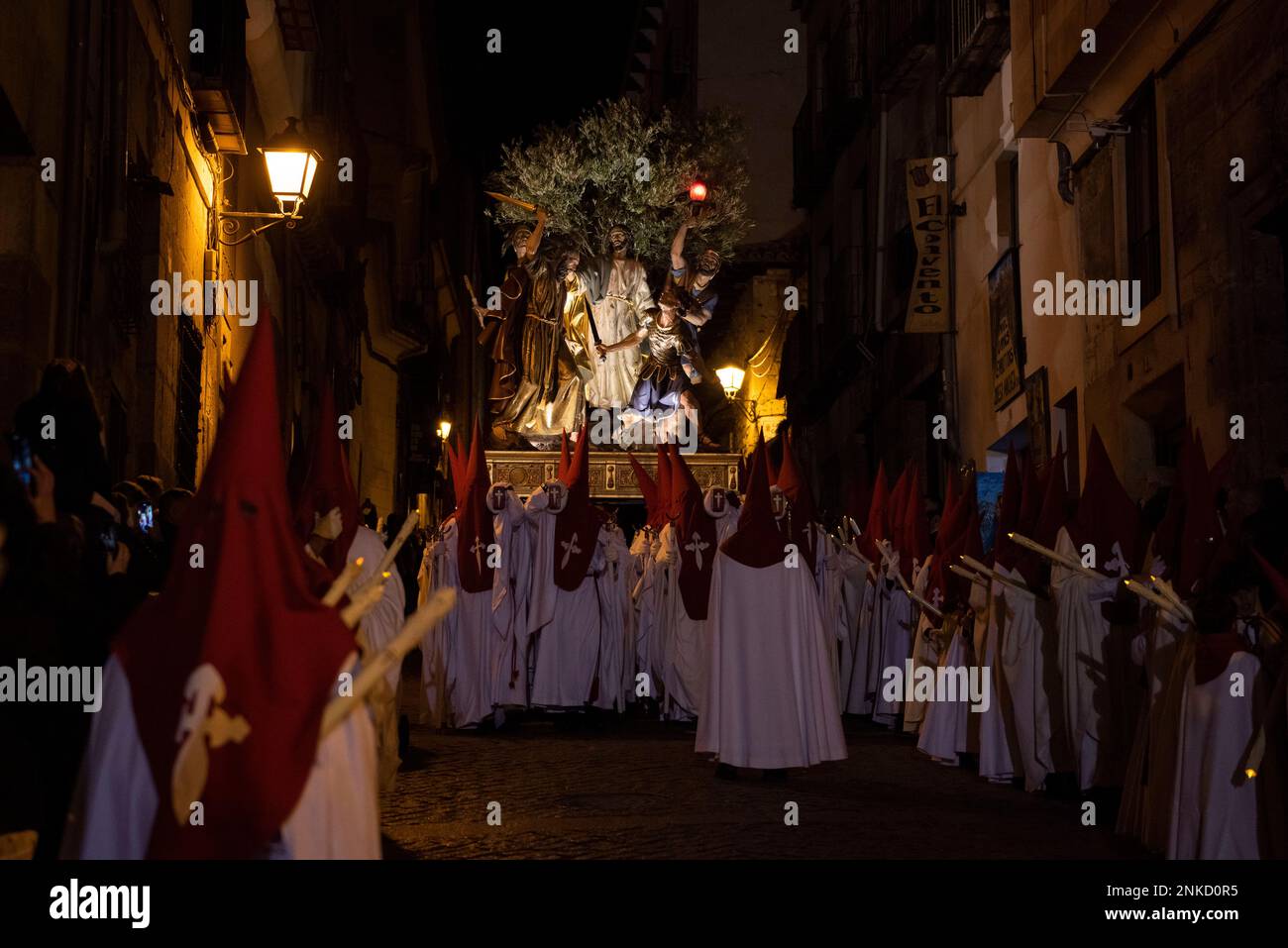 Several Nazarenes carry the paso of the Religious-Benevolent ...