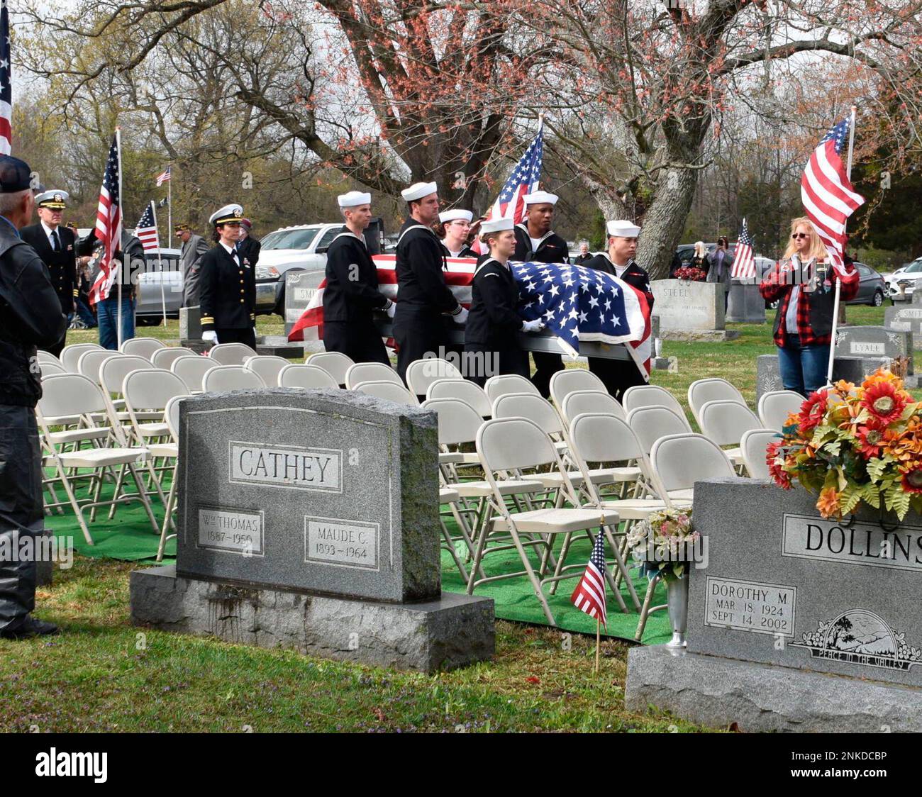 The flagdraped casket of U.S. Navy Fireman Second Class Hal Allison is carried during a