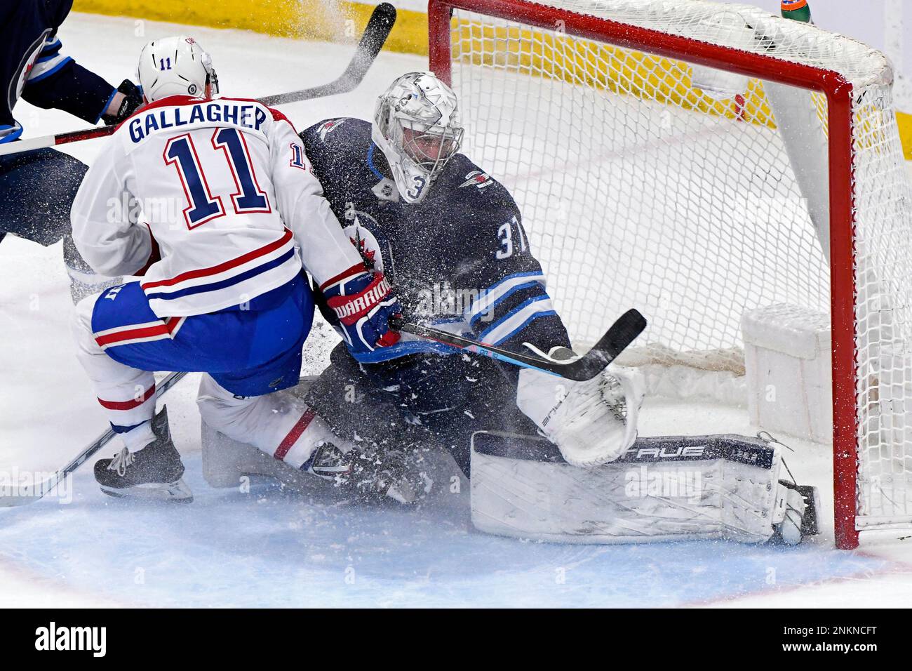 Montreal Canadiens' Brendan Gallagher (11) collides with Winnipeg Jets
