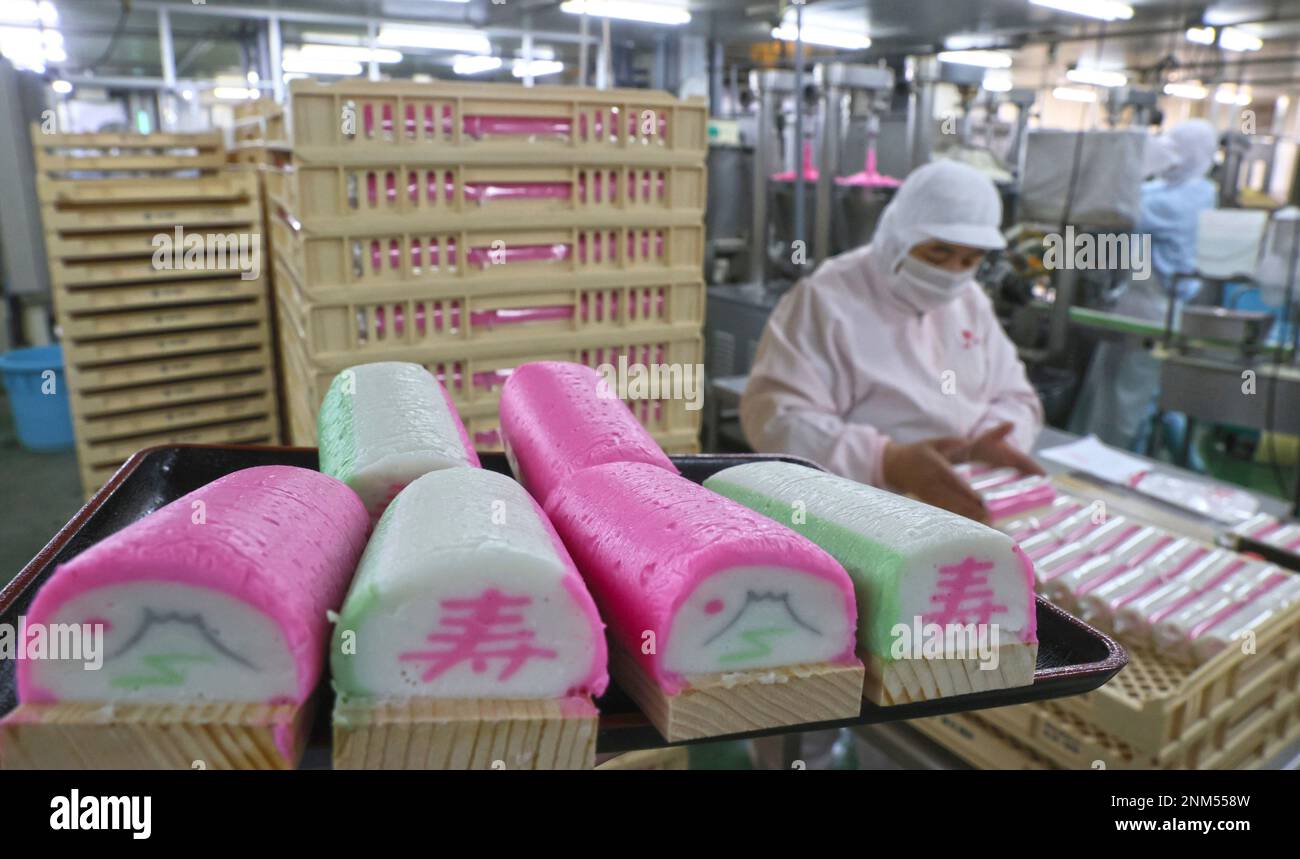 Workers make Kamaboko precessed fish paste for Osechi, Japanese