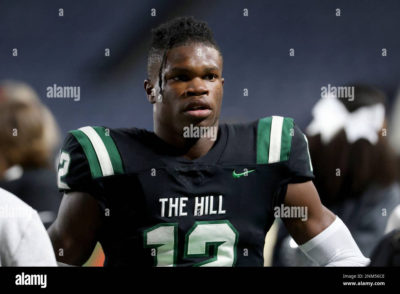 Collins Hill High School wide receiver Travis Hunter (12) watches warm