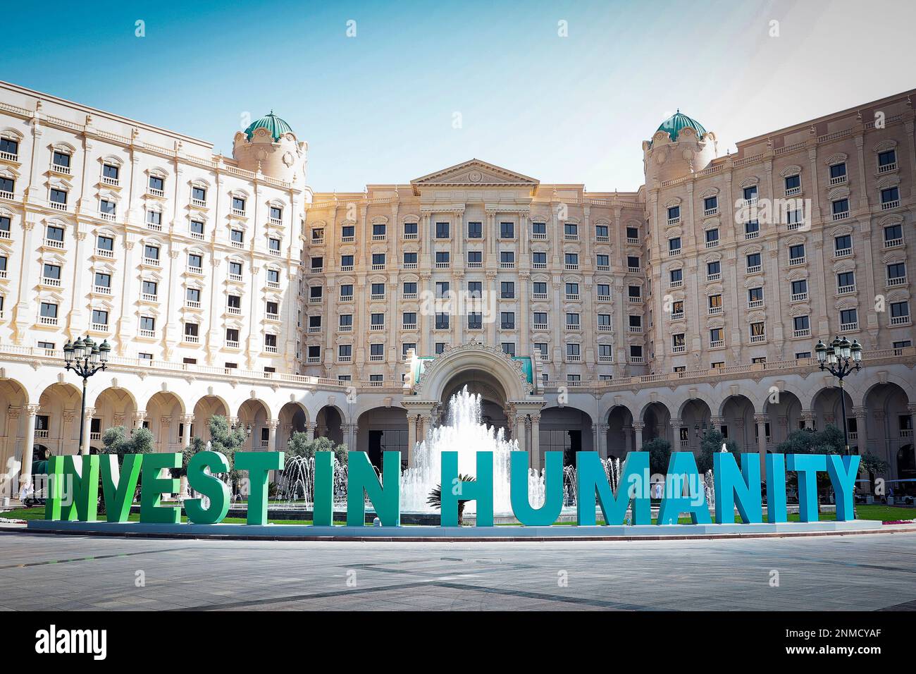 In this photo released by Future Investment Initiative, a slogan is ...