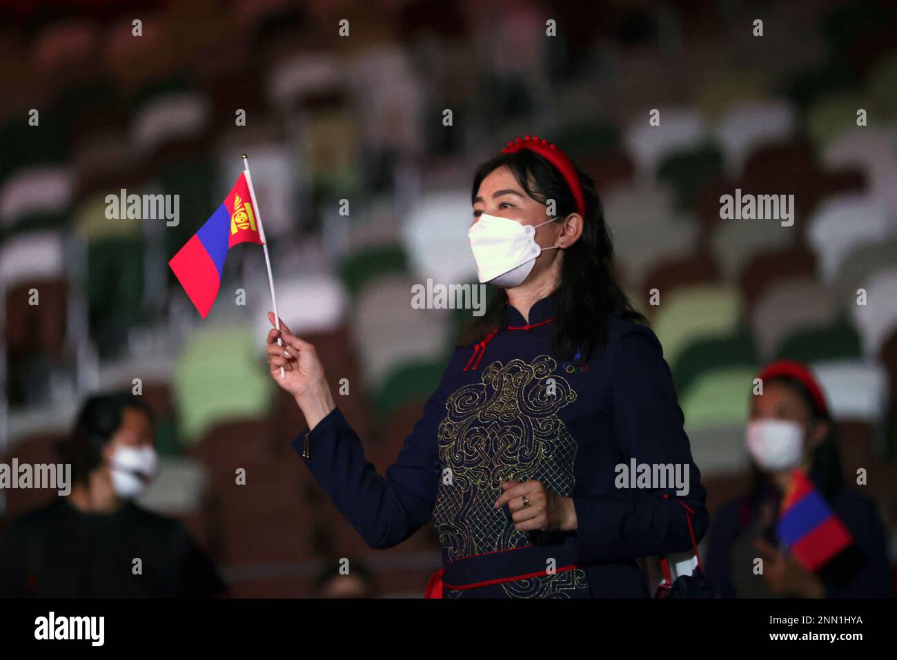 A member from Team Mongolia arrives during the opening ceremony in the Olympic Stadium at the 2020 Summer Olympics, Friday, July 23, 2021, in Tokyo, Japan. (Hannah McKay/Pool Photo via AP) Stockfoto