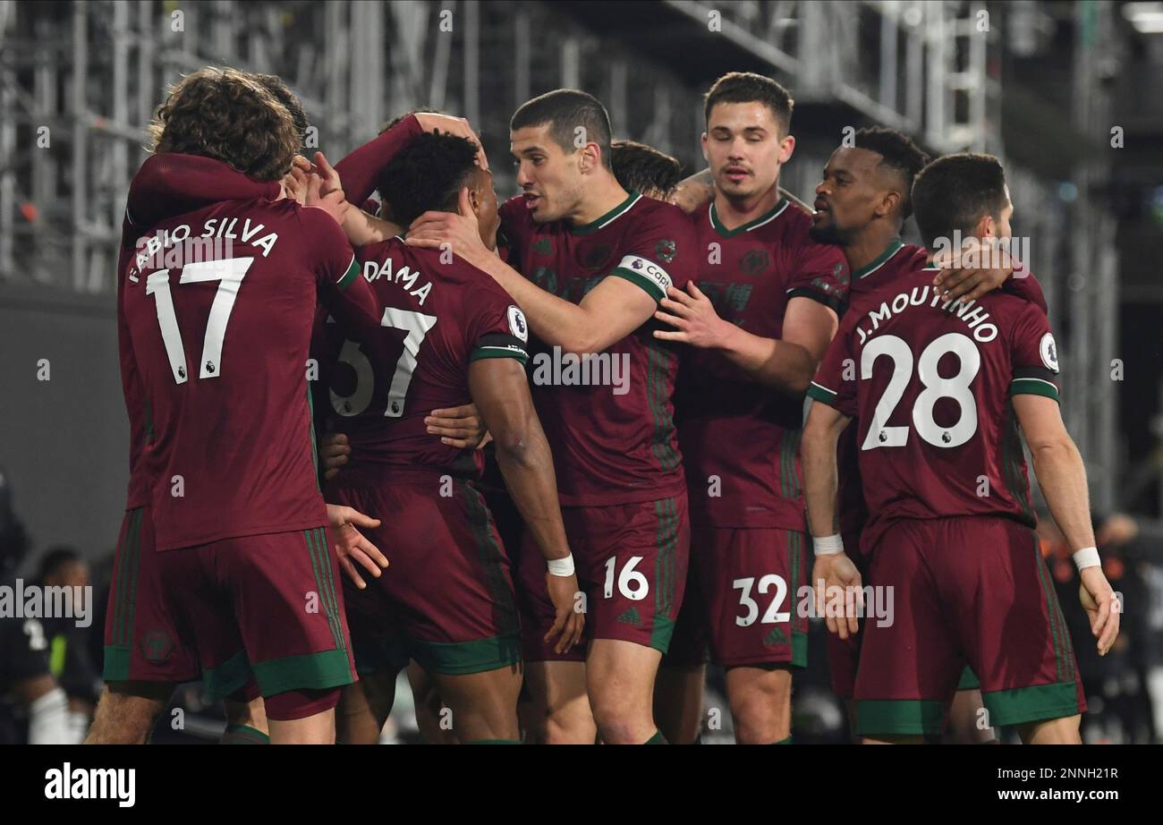 Wolverhampton Wanderers' players celebrate scoring their first goal during the English Premier League soccer match between Fulham and Wolverhampton Wanderers at Craven Cottage stadium in London, England, Friday, April 9, 2021.(Glyn Kirk/Pool via AP) Stockfoto
