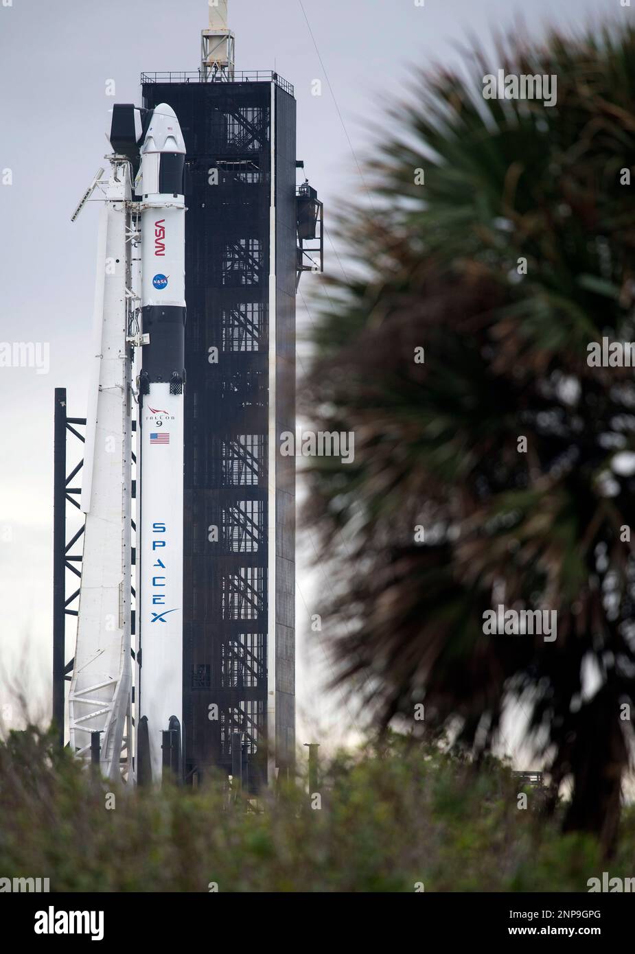 In this photo provided by NASA, a SpaceX Falcon 9 rocket with the ...