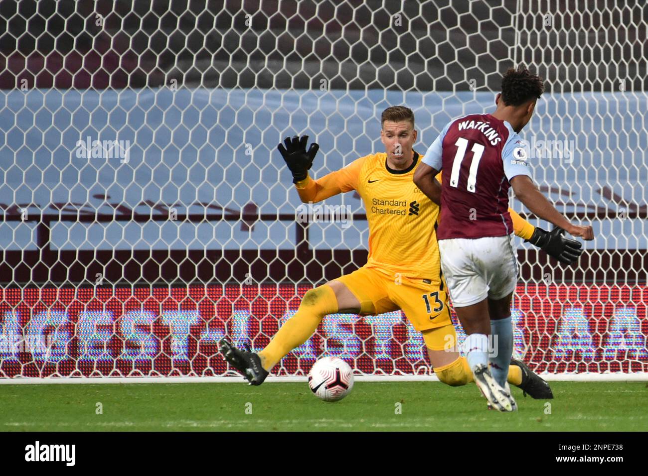 Liverpool's goalkeeper Adrian, left, makes a save in front Aston Villa's Ollie Watkins during the English Premier League soccer match between Aston Villa and Liverpool at the Villa Park stadium in Birmingham, England, Sunday, Oct. 4, 2020. (AP Photo/Rui Vieira, Pool) Stockfoto