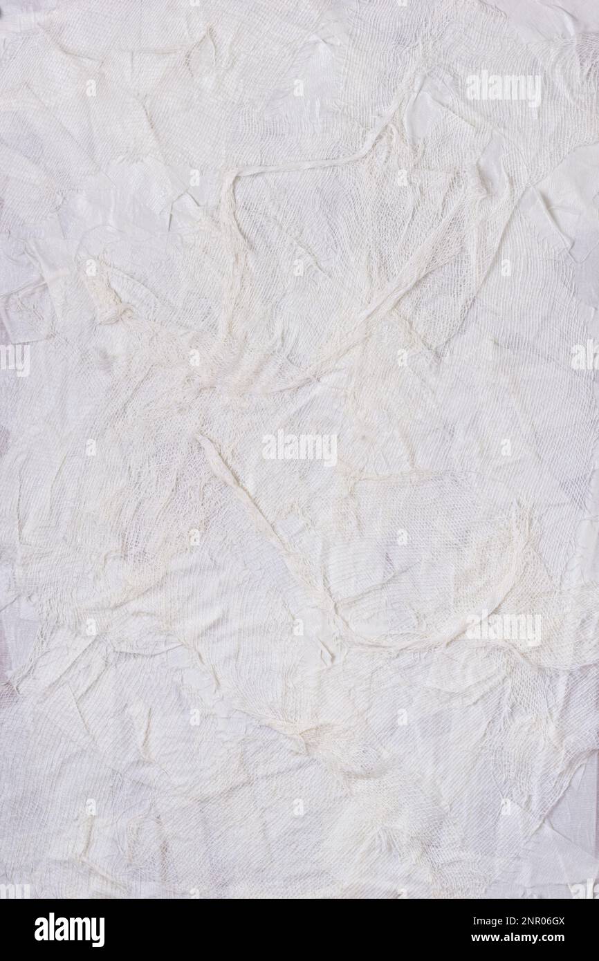 Strukturierter, handgefertigter weißer Textilhintergrund mit Mesh- und Papierbasis. Vertikaler Hintergrund für Design handgefertigt Stockfoto