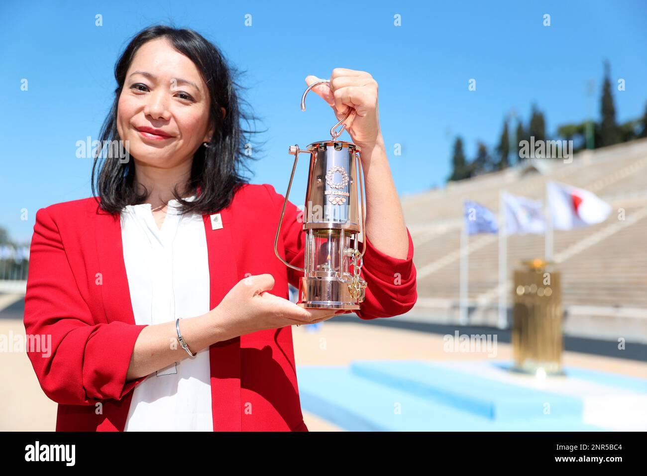 Naoko Imoto of Japan, former Olympic swimmer, holds the Olympic Flame