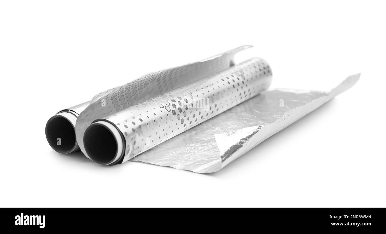 Rollen Aluminiumfolie auf weißem Tisch Stockfoto