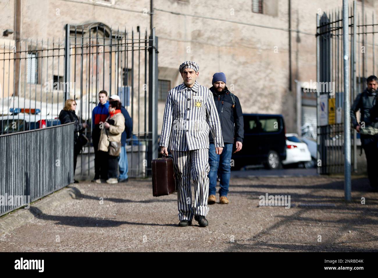 Actor Nicola Mette wears a striped uniform of the prisoners of Nazi