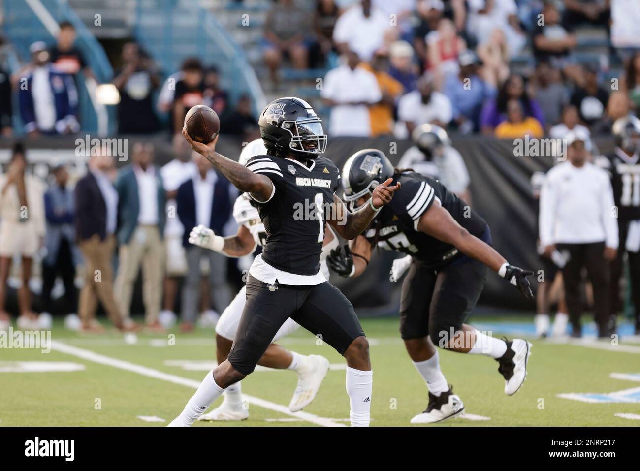 Team Robinson quarterback Larry Harrington (1) of Langston passes in