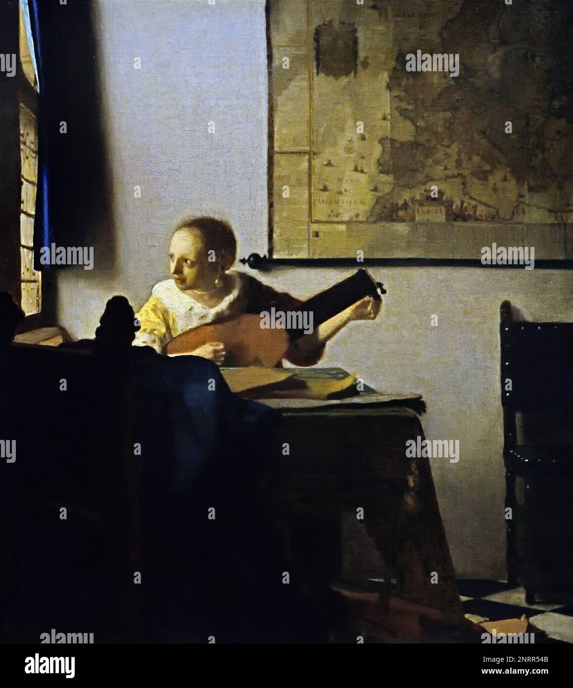 Young Woman with a Lute 1662-1664 von Johannes Vermeer oder Jan Vermeer 1632 - 1675, Delft, Niederlande, Niederländisch, Holland, (Holländischer Maler im Goldenen Zeitalter, einer der größten Maler des 17. Jahrhunderts. Bevorzugte zeitlose, gedämpfte Momente, bleibt rätselhaft, unnachahmliches Farbschema und verwirrender Lichtinhalt) Stockfoto