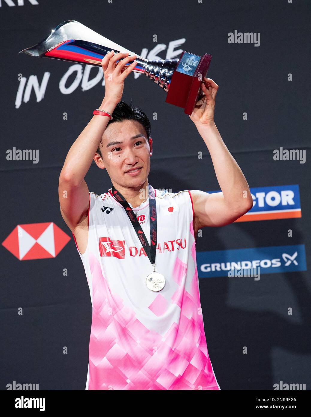 Kento Momoto of Japan poses with the trophy after winning against Chen ...
