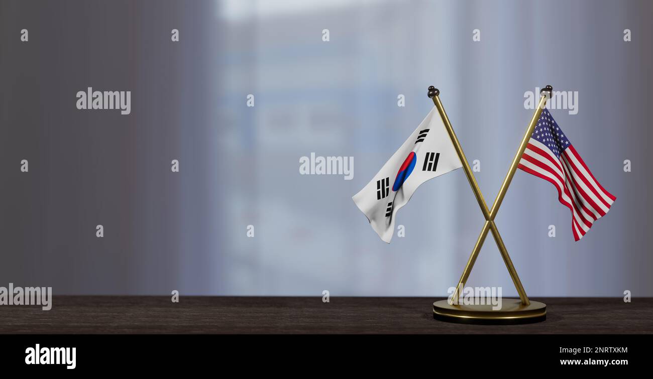 Südkorea- und USA-Flaggen auf dem Tisch. Verhandlungen zwischen Südkorea und den Vereinigten Staaten. Auf wenig unscharfem Hintergrund. 3D Arbeit und 3D Bild Stockfoto