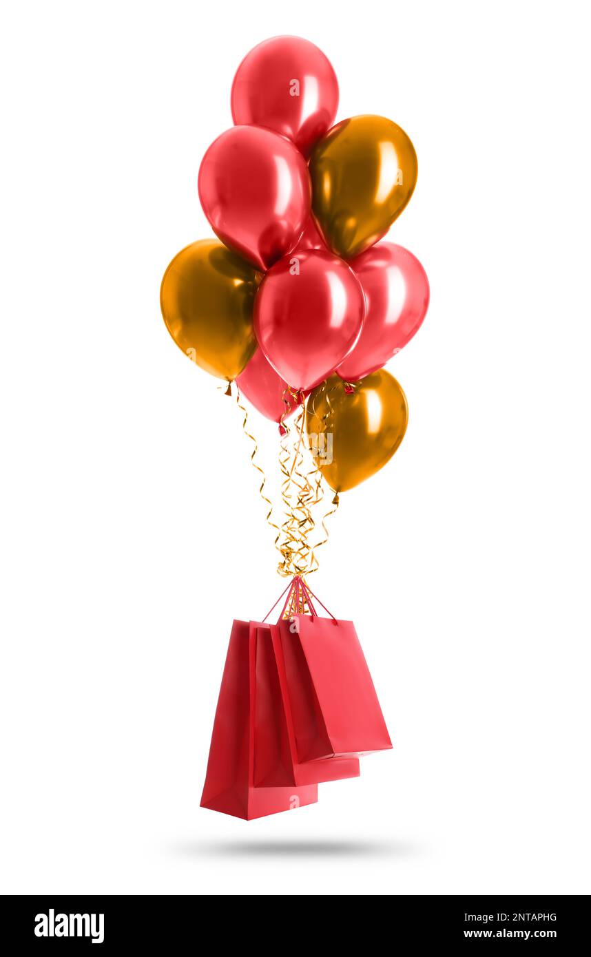 Bunte Ballons und rote Papiertüten auf weißem Hintergrund Stockfoto