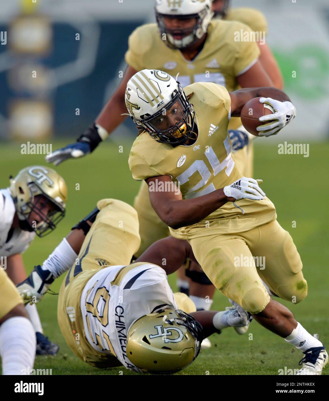 Georgia Tech's Jordan Mason (24) is tackled by defensive lineman T.K. Chimedza (93) during Georgia Tech's NCAA college spring football game Friday, April 26, 2019, in Atlanta. (Hyosub Shin/Atlanta Journal-Constitution via AP) Stockfoto