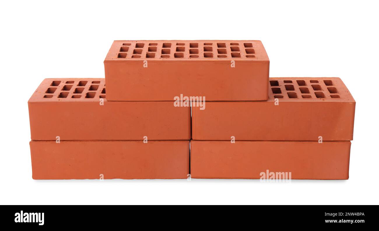 Viele rote Ziegel auf weißem Hintergrund. Baumaterial Stockfoto