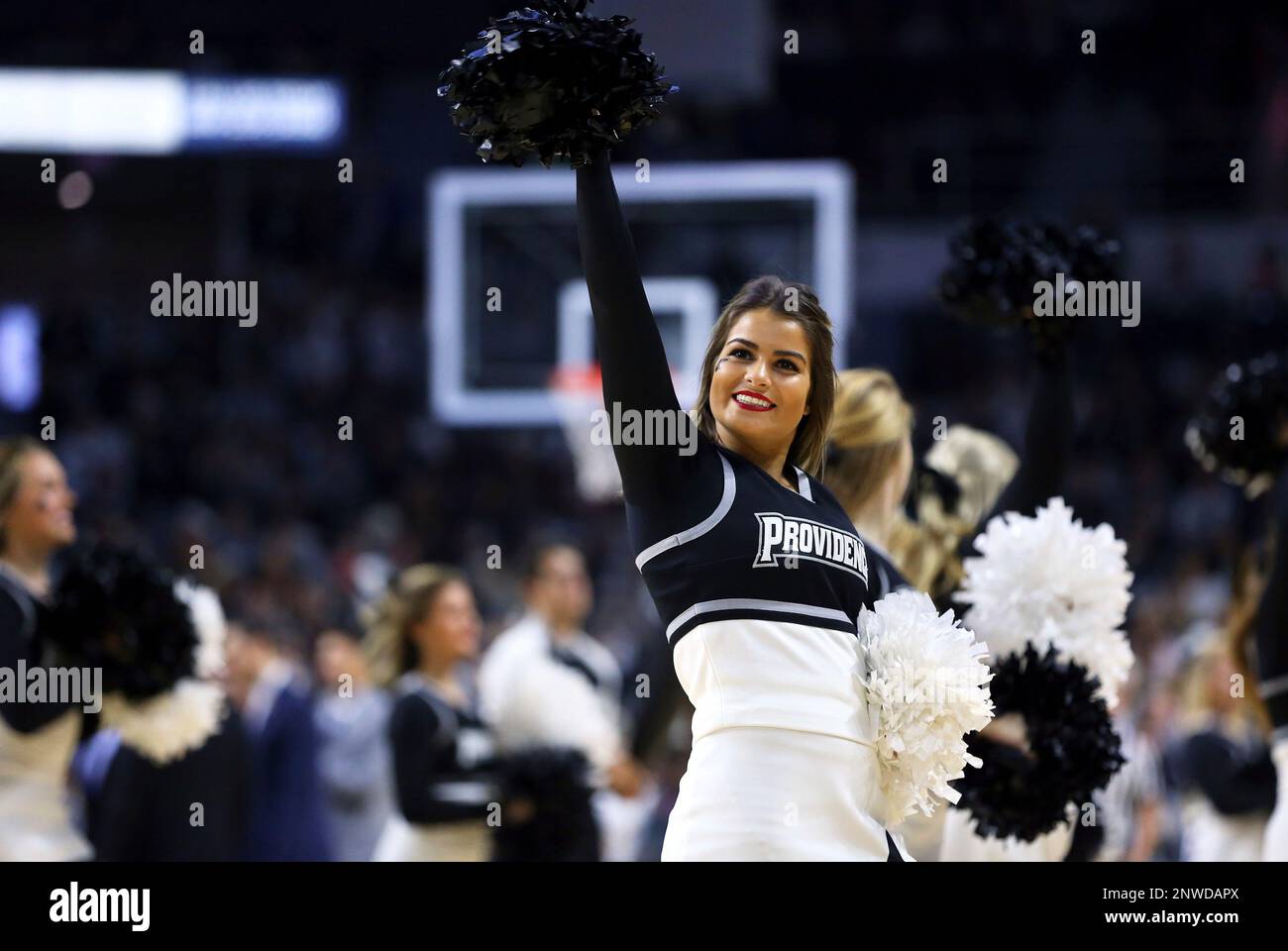 PROVIDENCE, RI - NOVEMBER 06: A Providence Friars cheerleader waves to the crowd during a college basketball game between Siena Saints and Providence Friars on November 6, 2018, at the Dunkin Donuts Center in Providence, RI. (Photo by M. Anthony Nesmith/Icon Sportswire) (Icon Sportswire via AP Images) Stockfoto