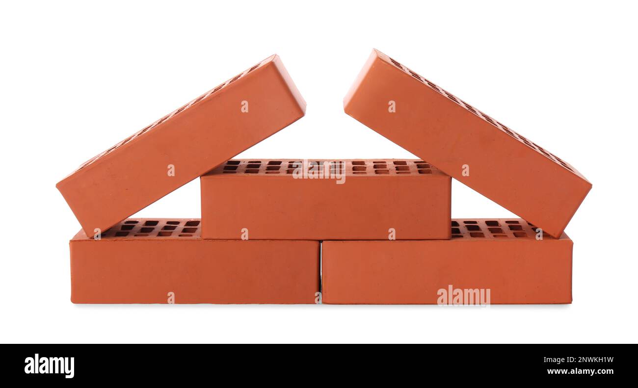 Viele rote Ziegel auf weißem Hintergrund. Baumaterial Stockfoto