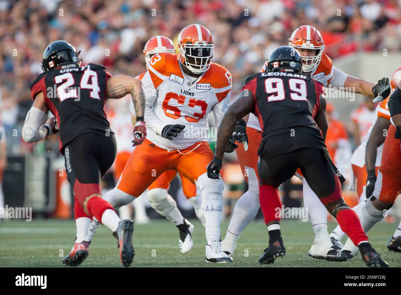 OTTAWA, ON - JULY 20: Jovan Olafioye (63 -- OL) of the BC Lions defends the Ottawa Redblacks rush in Canadian Football League (CFL) action at Ottawa's TD Place Stadium. (Photo by Sean Burges/Icon Sportswire) (Icon Sportswire via AP Images) Stockfoto