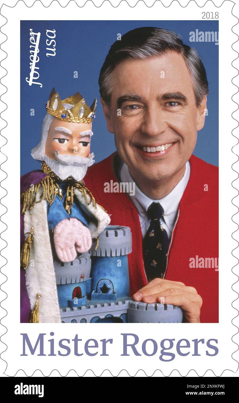 This image released by the United States Postal Service shows a postage stamp featuring Fred Rogers from the PBS children's television series "Mister Rogers' Neighborhood" with his King Friday XIII puppet. The U.S. Postal Service plans to issue a new stamp on March 23 in the same Pittsburgh public television station where the program was produced. Rogers died in 2003 at 74 after battling stomach cancer. (USPS via AP) Stockfoto