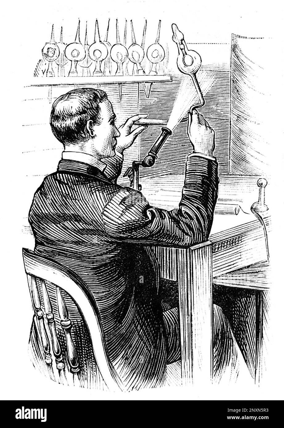 Eine Illustration eines Mannes, der eine Glasbirne für Thomas Edisons neues elektrisches Licht herstellt. Frank Leslies illustrierte Zeitung, 1880. Stockfoto
