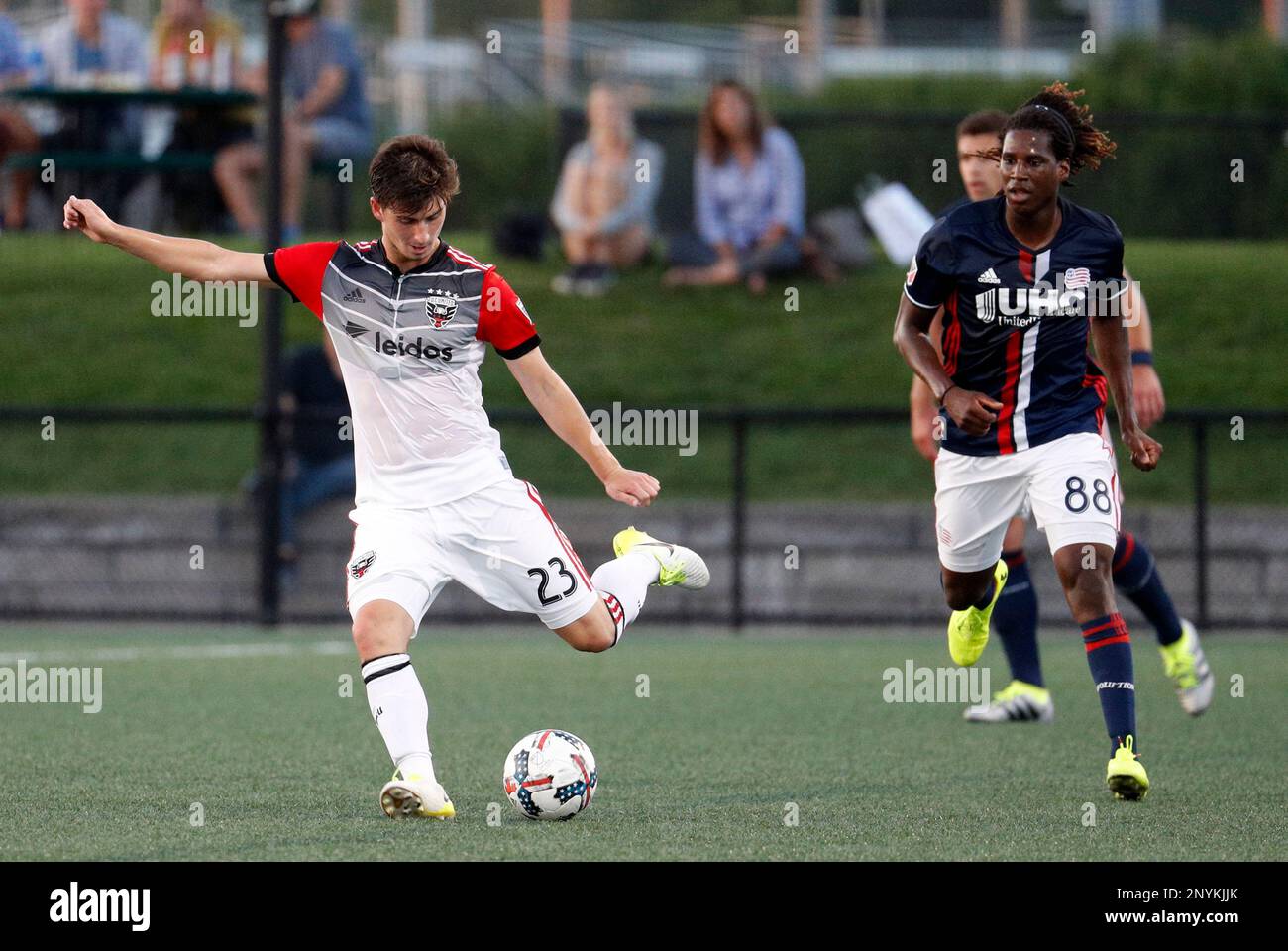 BOSTON, MA - JUNE 28: DC United midfielder Ian Harkes (23) plays the ball away from New England Revolution forward Femi Hollinger-Janzen (88) during a Round of 16 match for the 2017 Lamar Hunt US Open Cup between the New England Revolution and DC United on June 28, 2017, at Jordan Field in Boston, Massachusetts. (Photo by Fred Kfoury III/Icon Sportswire) (Icon Sportswire via AP Images) Stockfoto