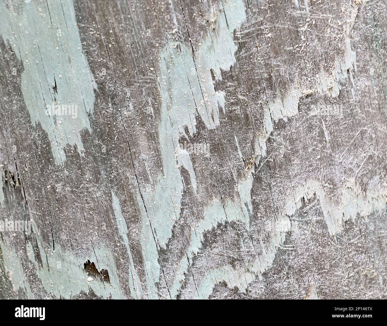 Abstraktes grungeliges Muster mit verblasster Farbe auf verwittertem Holz Stockfoto