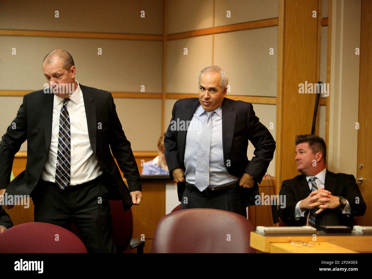 Lawyers Adam Filthaut, left, Stephen Diaco and Robert Adams get seating