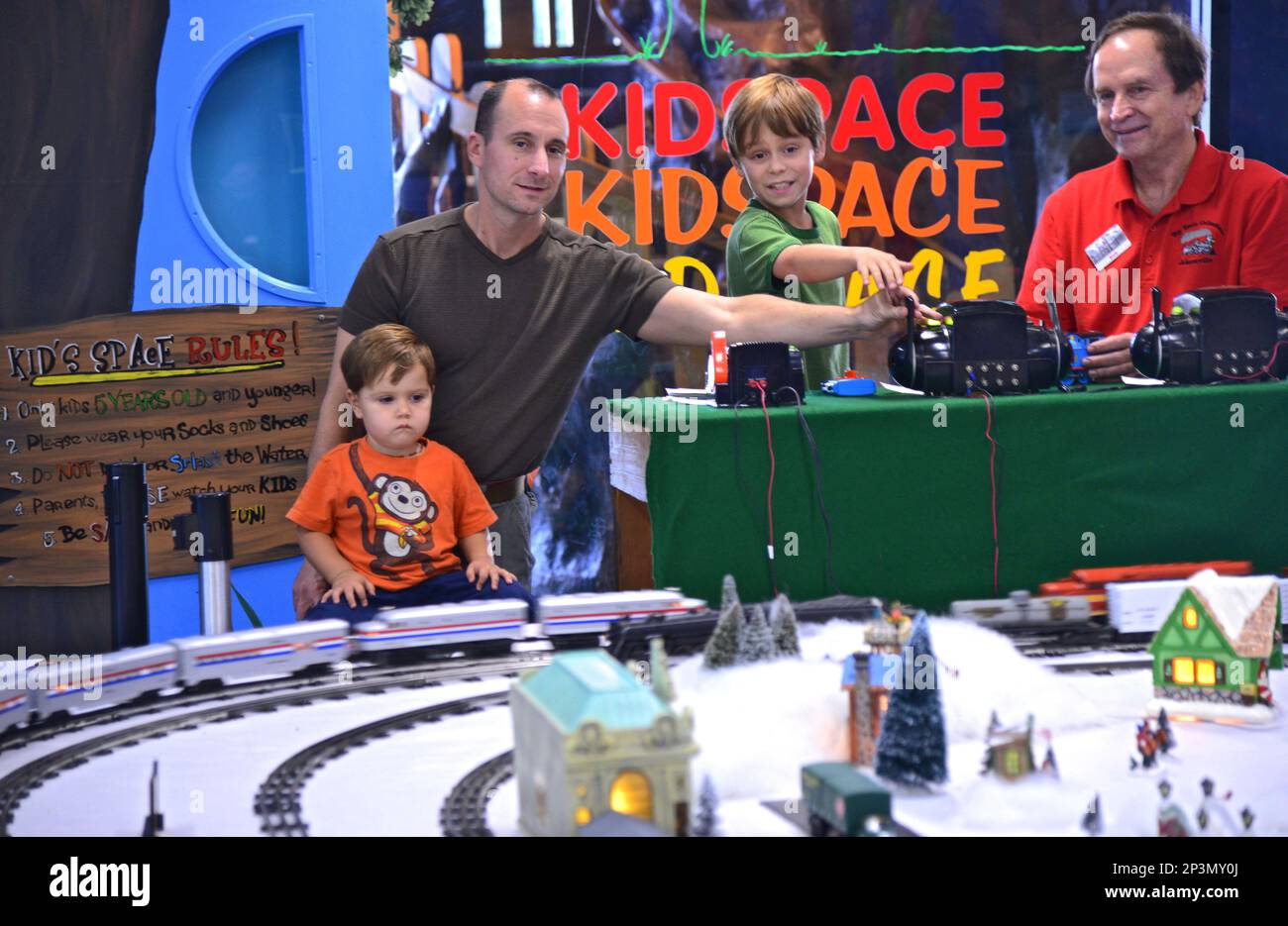 Bob Burch, right, one of the collectors who operated the model trains