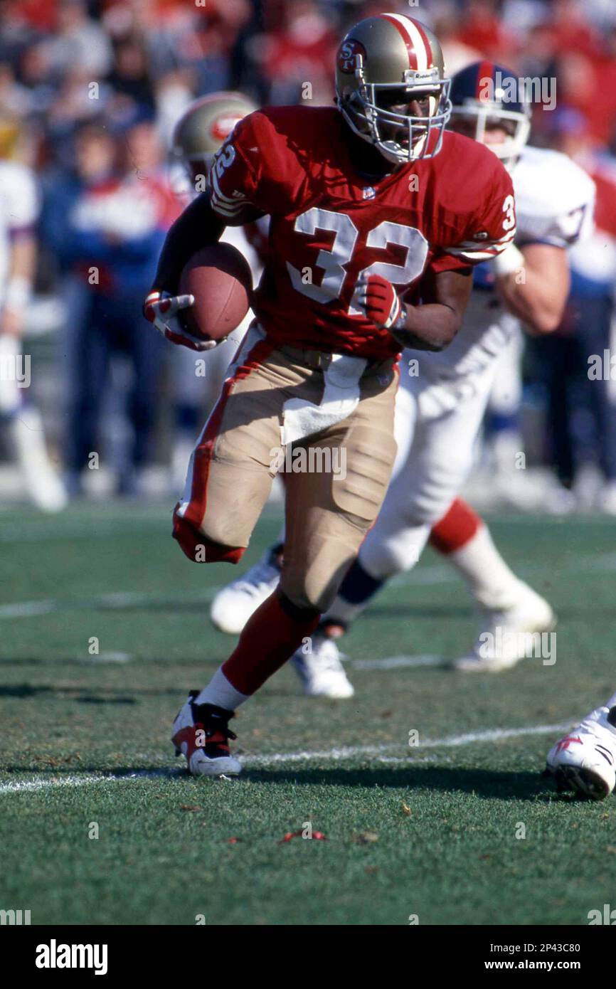Running back Ricky Watters #32 of the San Francisco 49ers runs against the New York Giants.Circa the 1980's. (Icon Sportswire via AP Images) Stockfoto