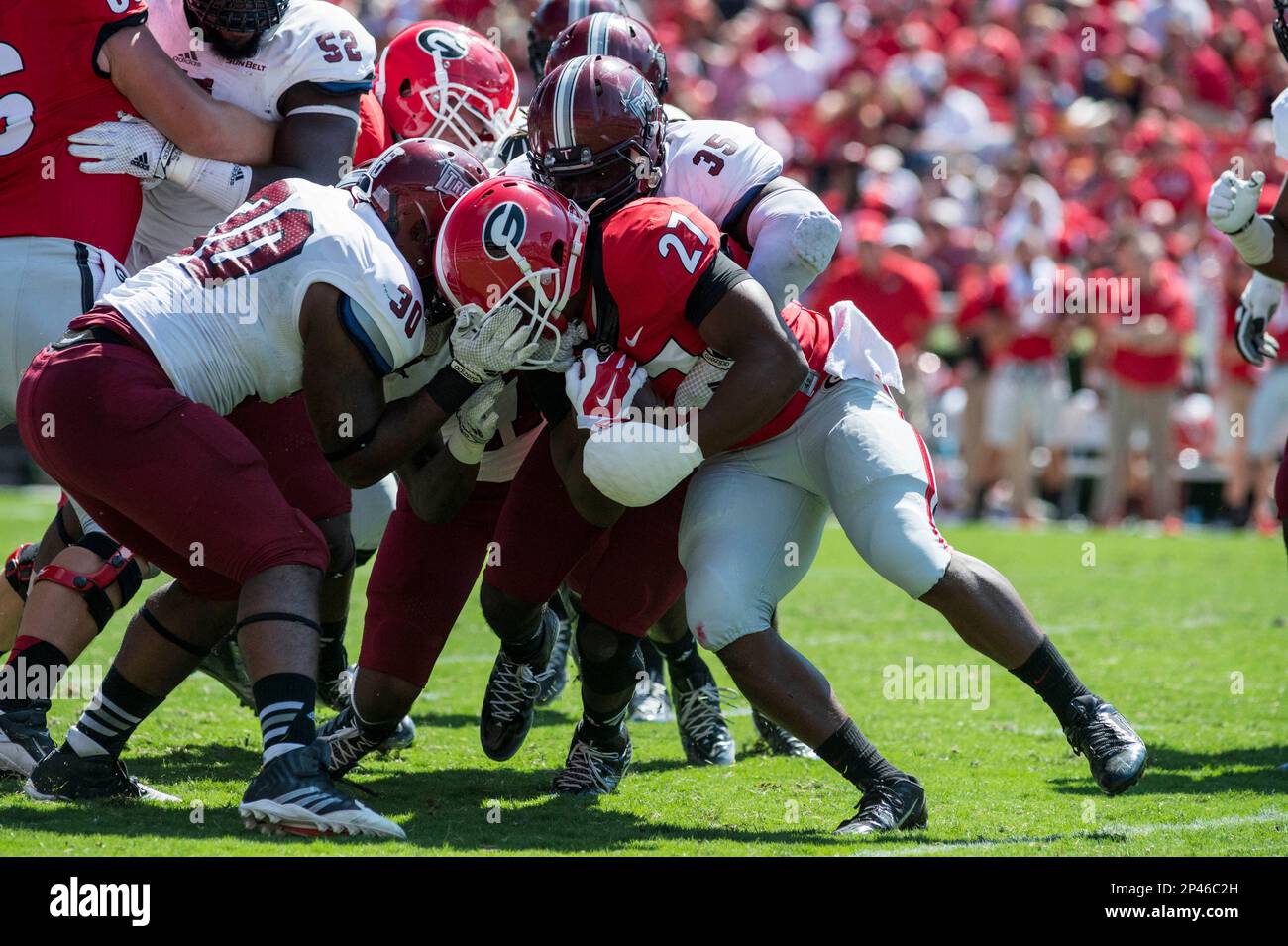 Sept. 20, 2014 - Athens, GA, United States of America - September 20, 2014 Athens, GA.UGA TB Nick Chubb is tackled by a group of Troy players during the College Football game between the Troy Trojans and the UGA Bulldogs at Sanford Stadium on September 20, 2014 in Athens, Georgia..UGA defeats Troy 66-0.Jacob Kupferman/CSM (Cal Sport Media via AP Images) Stockfoto