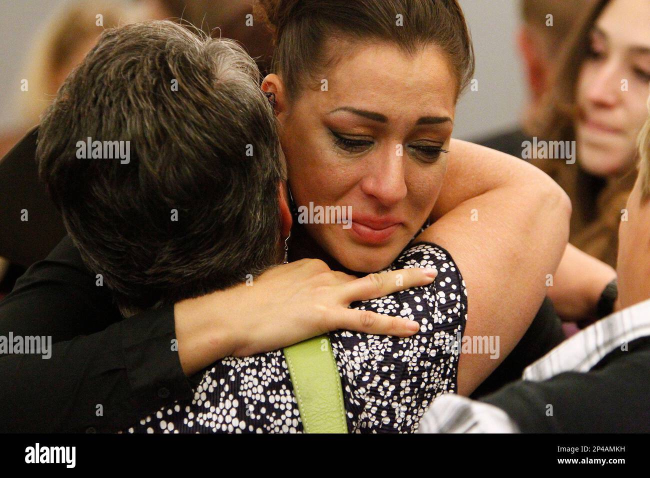 Celeste Flores Narvaez, rights, hugs her mother Elsie Narvaez following