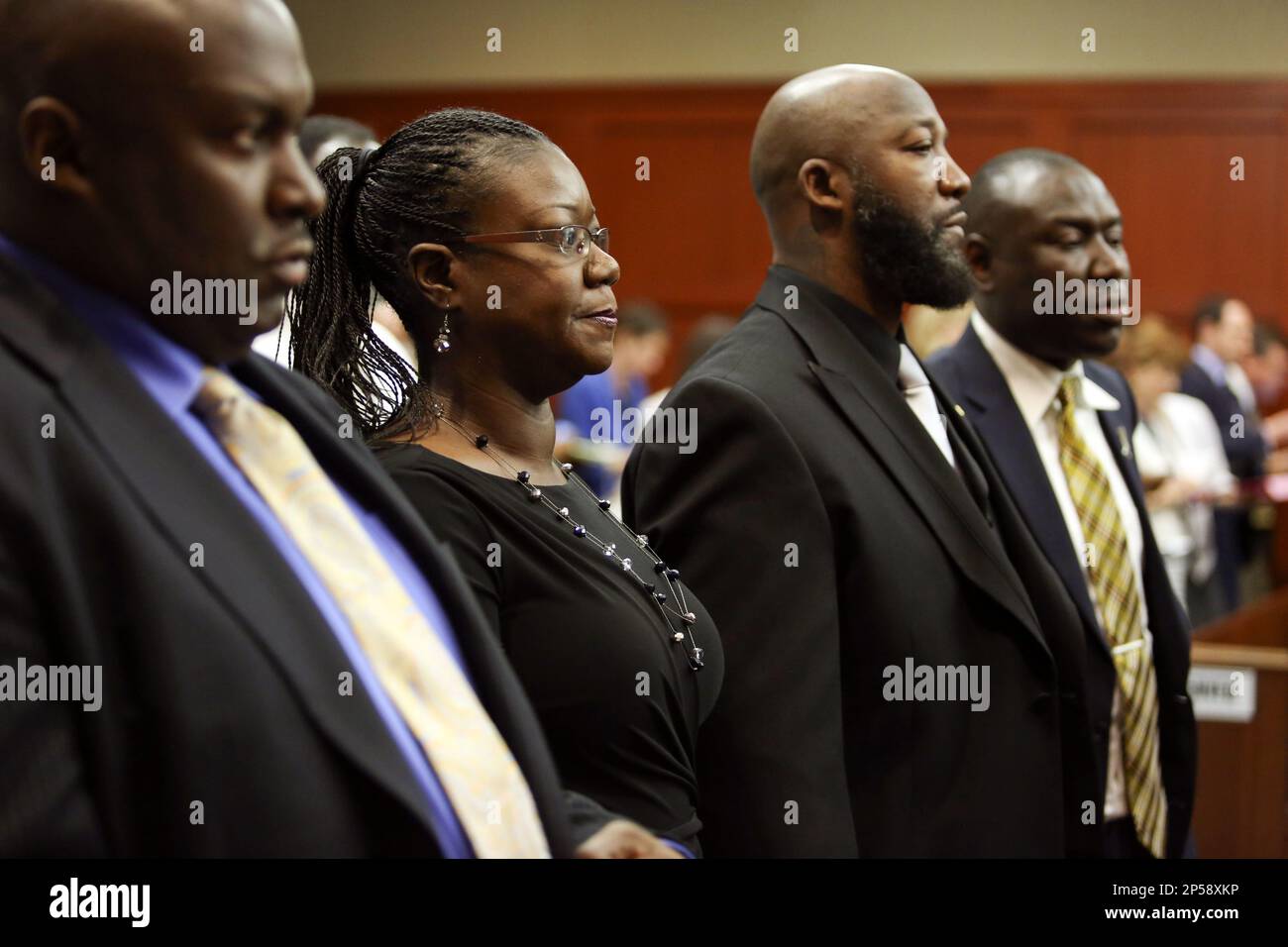 Flanked By Attorneys Daryl Parks Left And Benjamin Crump Far Right