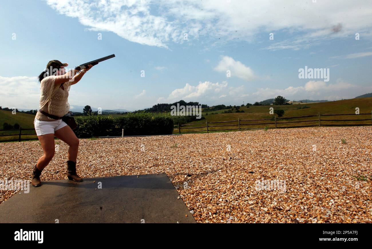 Afton Bricker, 21year old VMI keydet, powders a clay pigeon (puff of