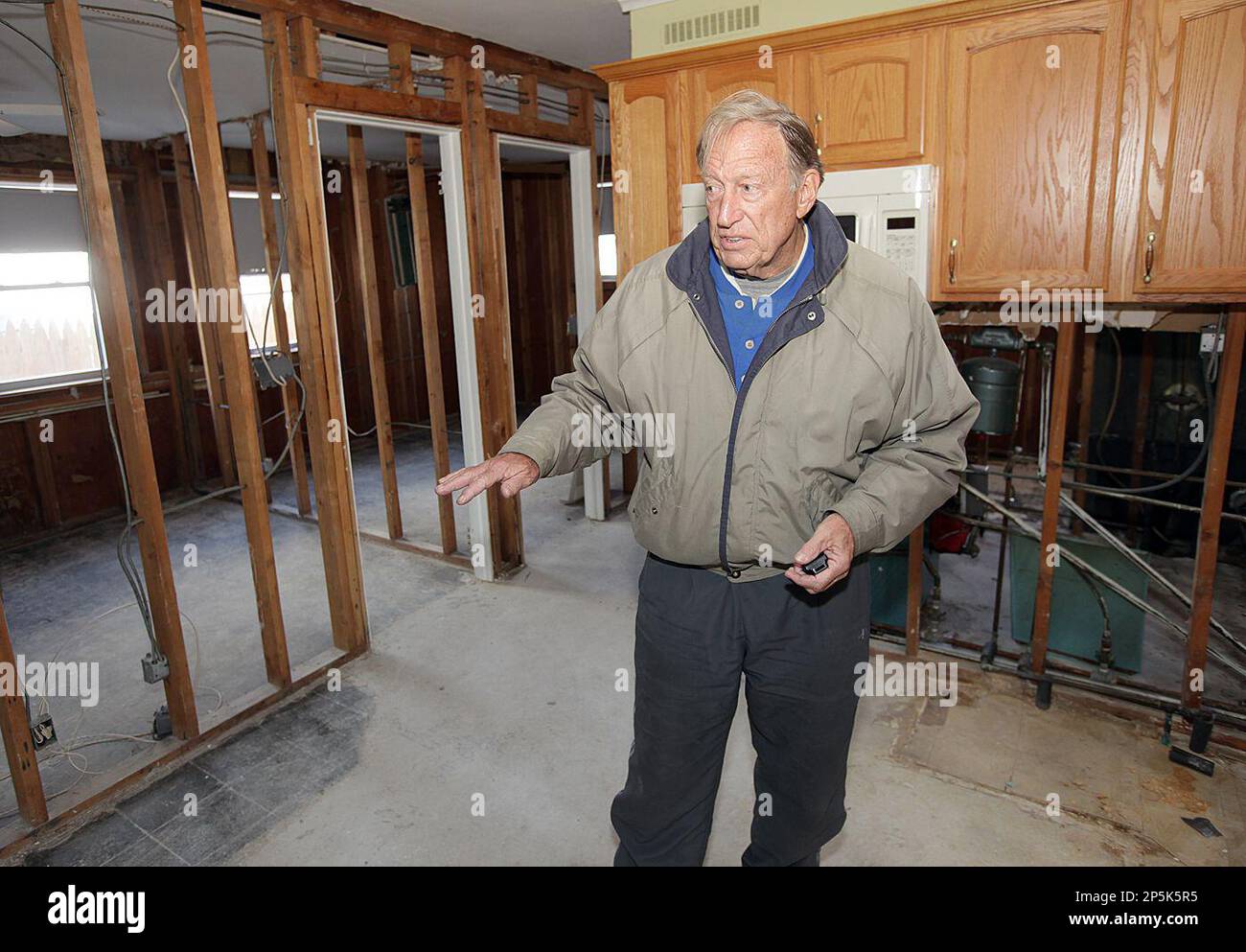 Real estate agent and Little Egg Harbor Township committeeman Ed Nuttall talks about storm damage inside a lagoon-front home he has listed in Mystic Islands, in Little Egg Harbor Township, southern Ocean County, NJ, Wednesday, Feb. 27, 2013. Homes that were damaged and flooded out during Superstorm Sandy have hit the market and are listed way below their usual market value for a waterfront/waterside property.(Dale Gerhard/The Press of Atlantic City) Stockfoto