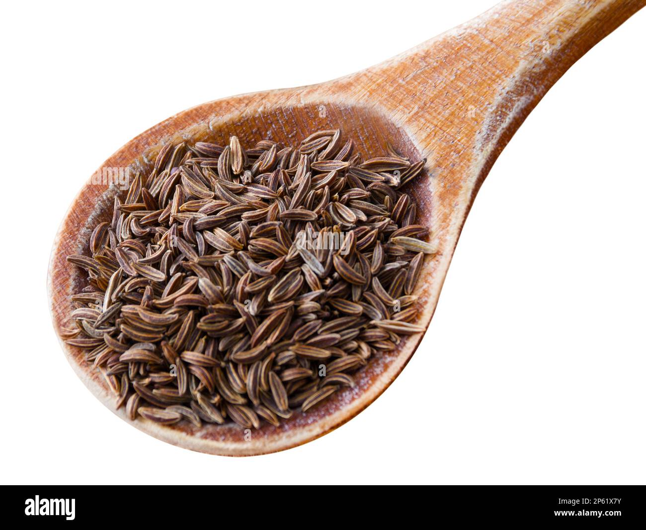 Kümmelsamen und Holzlöffel isoliert auf weißem Hintergrund Stockfoto